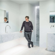 Portrait of John Pawson with his COCOON collection, stone sink
