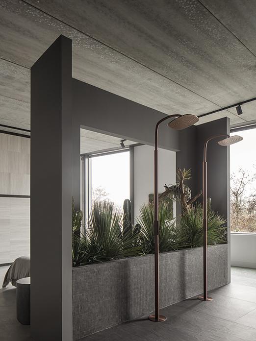 outdoor shower by COCOON in dark gray with accents of plants, a way to make client dreams a reality